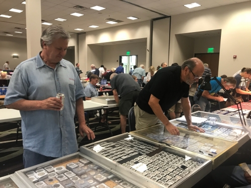 Royal Coin Employee Working At The Coin Show