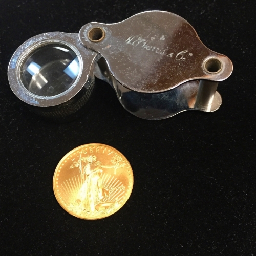Coin Loupe With American Gold Eagle Coin For Inspection